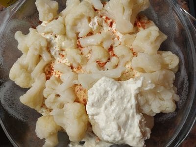 Pour half of the mixture on top of the cauliflower layer Cheesy Roasted Cauliflower