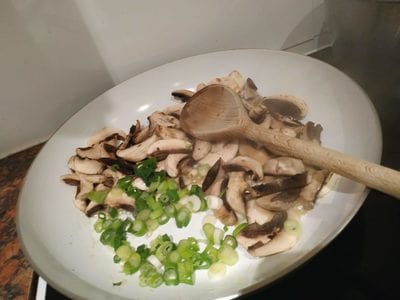 Add the freshly chopped spring onions Cognac Chestnut Mushrooms on Floating Zucchini with Asparagus