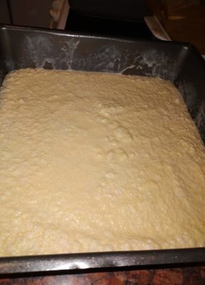 Pour the mixture in a 25cm by 25cm greased baking tray Lemon and Custard Cake