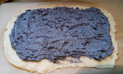 Spread half the poppy seed filling leaving a 1-inch border Poppy Seed Roll