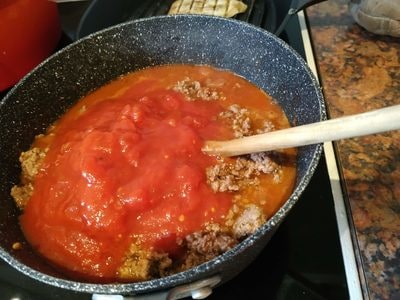 Add a can of chopped tomatoes with herbs Beef & Eggplant Lasagne