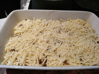 Add grated cheddar on beef Beef & Eggplant Lasagne