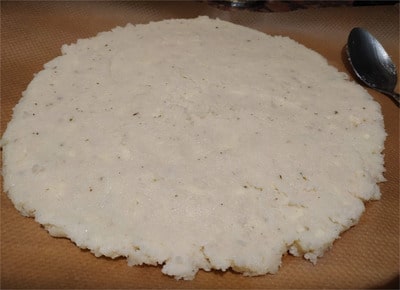 Spread the other half on a separate parchment paper Cauliflower Base Pizza