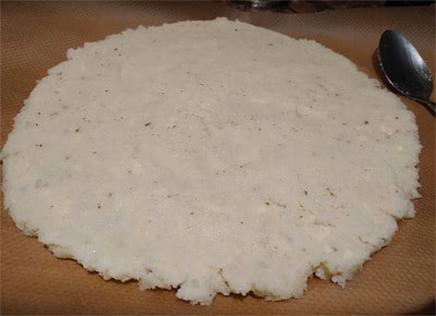 Spread the other half on a separate parchment paper Cauliflower Base Pizza