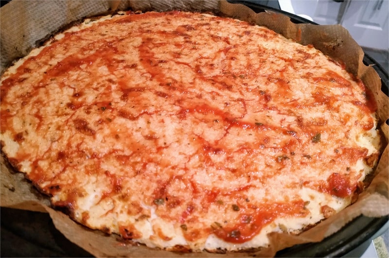 spread 3-5 tablespoons of basil and oregano passata or homemade tomato sauce Cauliflower Base Pizza