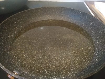 Add cooking oil into a skillet Cheese Doughnuts