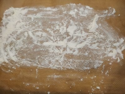 Flour a working wooden board Cheese Doughnuts