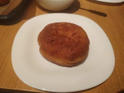 Place a doughnut on a serving plate Cheese Doughnuts