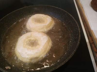 Place the doughnut rings in the preheated oil Cheese Doughnuts