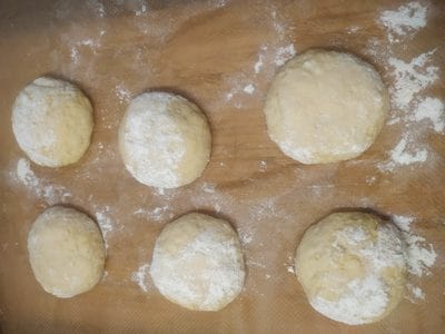 Shape the doughnut by making a large ball and then flatten it Cheese Doughnuts