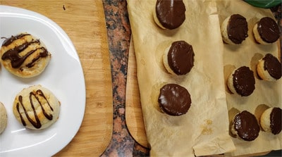 Once set, you can then place them on a serving tray and also drizzle the top of the macaroons with the remaining chocolate Coconut Macaroons