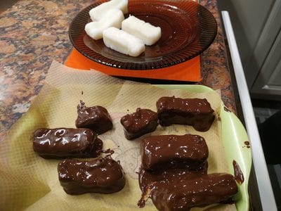 Place a baking paper on a tray or plate and add the chocolate patties dark chocolate Homemade Bounty Bars