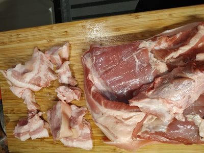 Slicing and cutting the fat parts of bacon Homemade Pork Cracklings