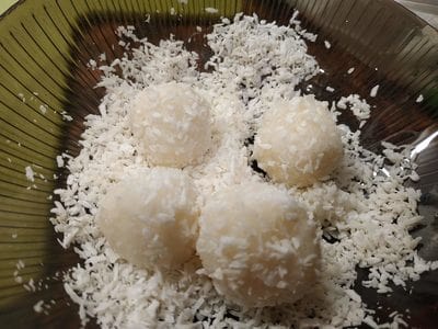 Roll 10 grams balls into shredded coconut Homemade Raffaello Coconut Balls