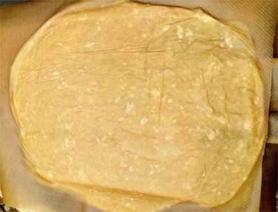 Roll out the dough keeping it between the two parchment papers Mozzarella Swirls