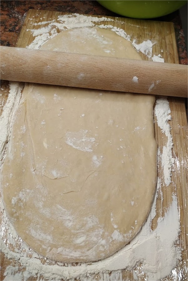 Roll the dough out into a half inch thick layer My Grandma’s Doughnuts