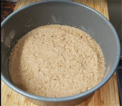 Place the mixture in the base of the cake tin and spread in an even layer, then flatten using the back of a spoon or a spatula New York Strawberry Cheesecake