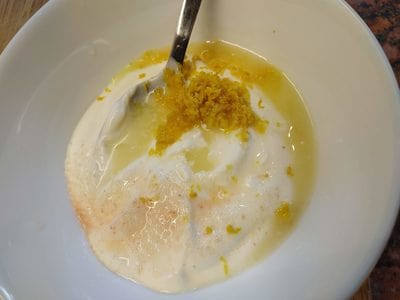 Soured cream with lemon juice lemon zest seasoning and pink salt Roasted Celeriac with Soured Cream and Sesame Seeds