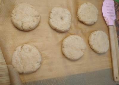 Flatten the dough balls Sesame Bagels