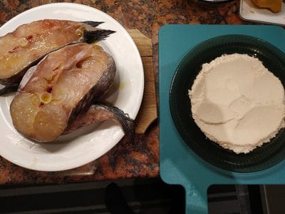 Add 2 tablespoons of coconut powder on a plate Southern Pan Fried Catfish