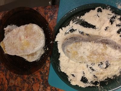 Dip the catfish rounds into the flour Southern Pan Fried Catfish
