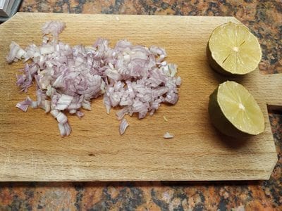 Chop the shallot and cut a lime in half Avocado with Stuffed Tuna