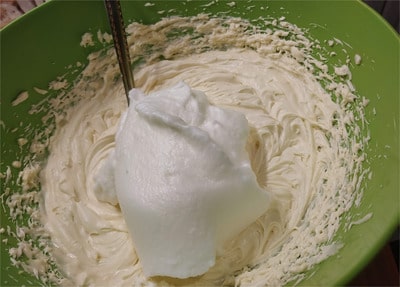 Add in the egg whites into the Mascarpone mixture and gently fold them in Sugar Free Tiramisu