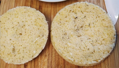 Using a bread knife, slice the bread in two 90 Seconds Bread