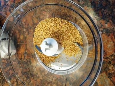 Add the sesame seeds into a food processor Best Tahini Recipe