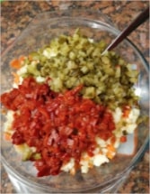 Chop all the pickles and roasted pepper into small pieces and add them into a paper towel lined bowl to soak up all the extra liquid Boeuf Salad (Chicken and Potato Salad)