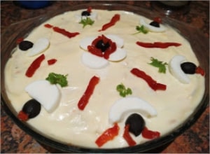 Decorate the salad with black olives, slices of red roasted pepper, parsley leaves and boiled egg whites Boeuf Salad (Chicken and Potato Salad)