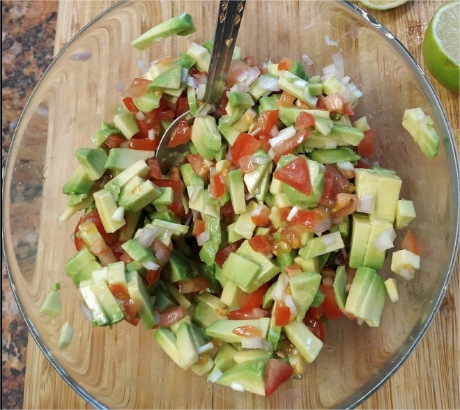 Mix in onion, chopped jalapeño, fresh leaves, diced tomatoes and minced garlic Classic Guacamole Salad