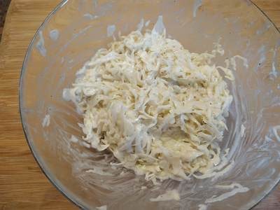 Add the sliced cabbage and mix well for Salad Coleslaw