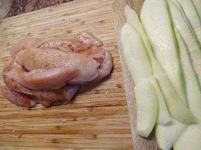 Season the chicken breasts for Dijon Mustard Chicken & Courgette Rolls