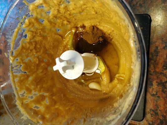 Add-cumin-pink-salt-garlic-and-olive oil Easy Hummus Recipe