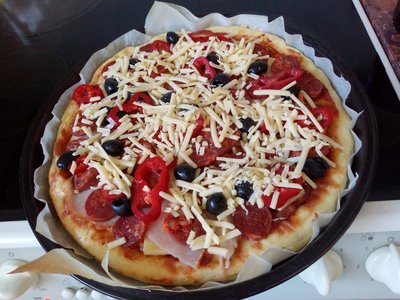 Fathead pizza dough add tomato sauce and other ingredients