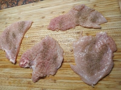Cut the chicken breast for German Chicken Schnitzel
