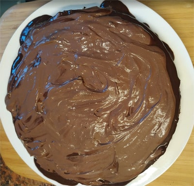 Add the cream on top of one of the chocolate sponges and spread it evenly Kids’ Favourite Chocolate Cake
