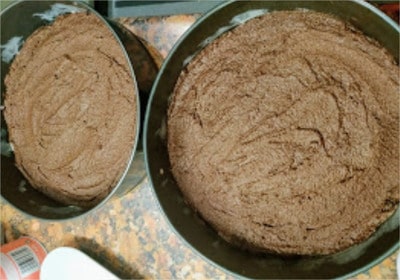 Divide the batter in two and place it into each of your non-stick paper-lined baking cake tins Kids’ Favourite Chocolate Cake