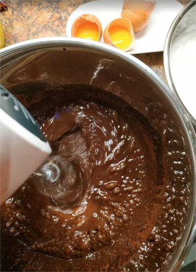 In the chocolate mixture, add one yolk at the time and mix them in with an electric mixer until all yolks are well incorporated Kids’ Favourite Chocolate Cake