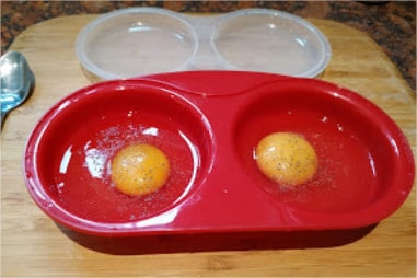 Pierce each egg yolk with a fork and add 1 teaspoon water to each cup Microwave Poached Eggs
