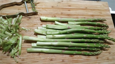 For perfectly crisp and tender asparagus, peel the bottom half of the stalks before roasting them in the ovenRoasted Asparagus with Grana Padana