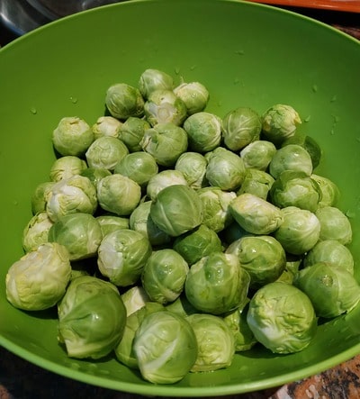 Trim and wash the Brussels sprouts Roasted Parmesan Brussels Sprouts