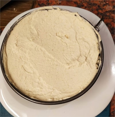 Pour 2/3 of the mixture on top of the first sponge layer, up to the top of the springform tin Special Walnut, Coffee and Cognac Mini Cake