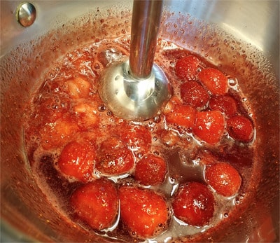 With an electric hand masher or with a vegetable masher, mash the strawberries thoroughly Strawberry Puree