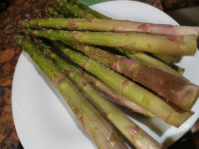 Sprinkle with garlic and salt Cognac Chestnut Mushrooms on Floating Zucchini with Asparagus