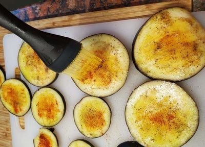 Brush each eggplant round with garlic oil and sprinkle it with salt, pepper and smoked paprika Grilled Eggplant with Soured Cream